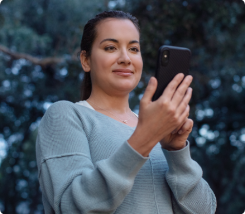 Person looking at their smartphone.